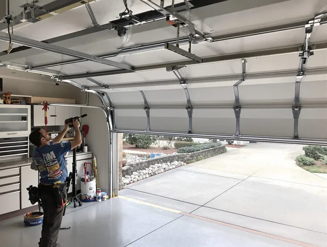 Garage door track repair service by Plainfield Garage Door Repair in Plainfield
